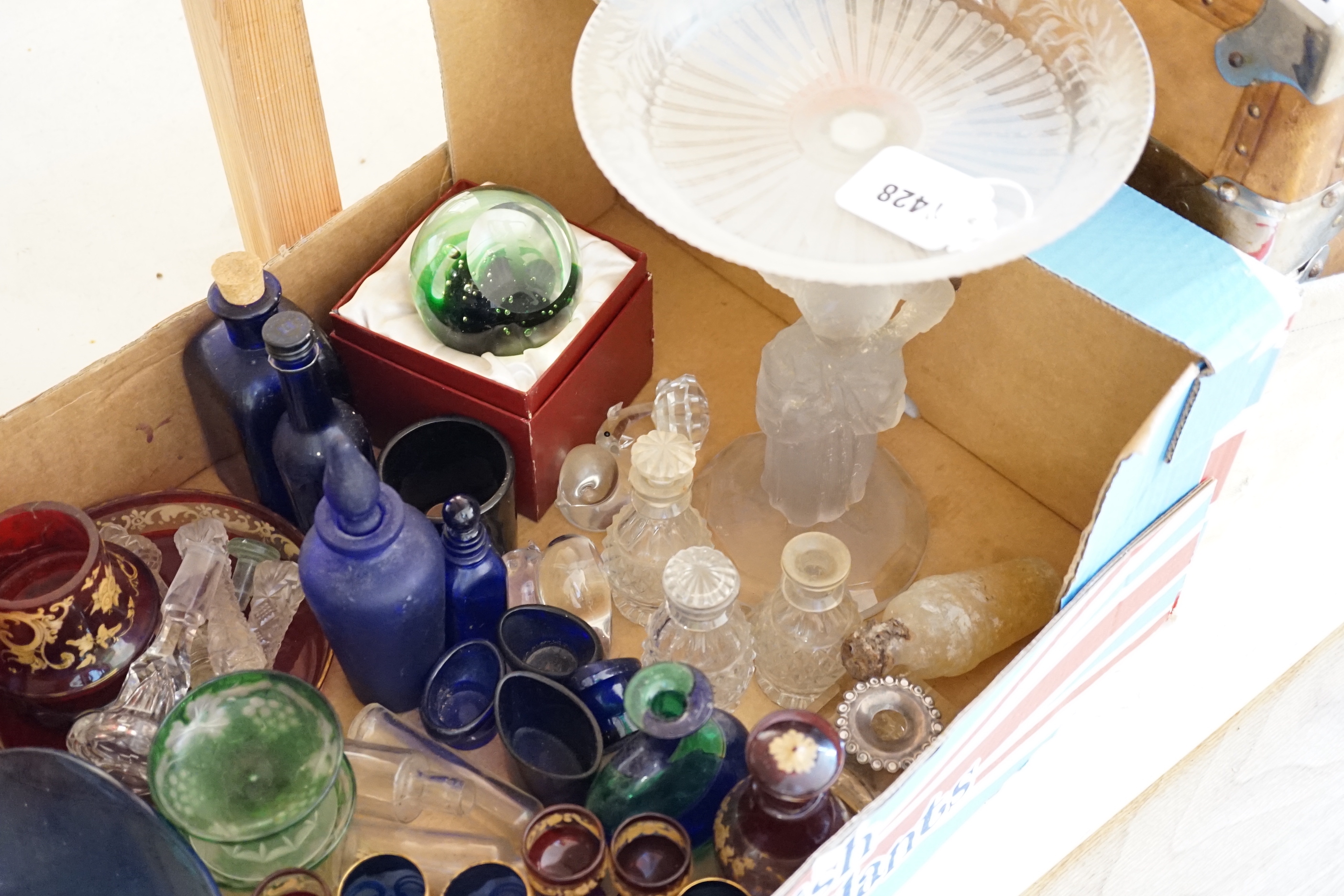 A collection of clear and coloured glassware